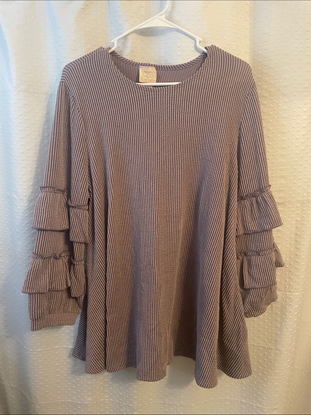 ZADIE B’s ribbed knit top w/ ruffle sleeves